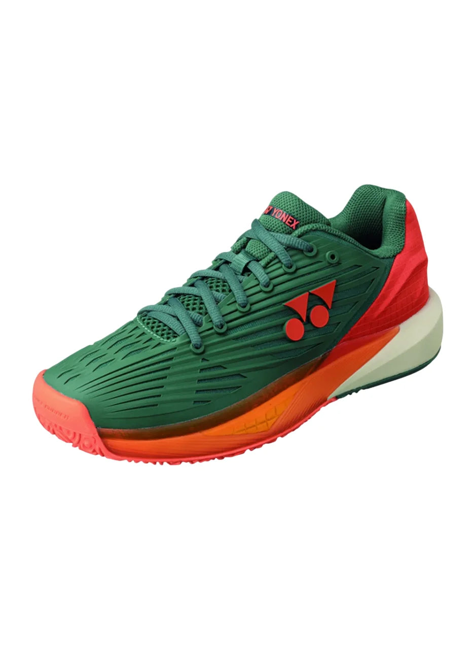 zapatillas yonex verdes con suela naranja para pádel en arcilla