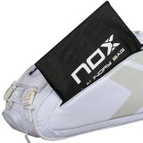 bolsa padel nox at10 team blanca con compartimento principal amplio para palas de padel